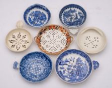 A group of seven late 18th/early 19th century English pottery and porcelain egg strainers: