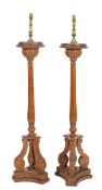 A pair of carved pine torchere stands in Neoclassical style,