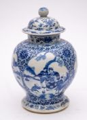 A Chinese blue and white baluster jar and cover: painted with four lotus-shaped panels depicting