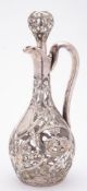 An American Art Nouveau clear glass and silver overlay decanter and stopper: with slender neck and