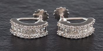 A pair of princess and round brilliant-cut diamond, half hoop earrings,