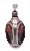 An Egyptian brown glass, silver and niello decorated decanter: of dimple shape,