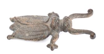A brass boot jack: in the form of a winged beatle, 26cm long.