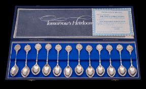 A set of twelve Elizabeth II silver teaspoons with zodiac terminals, maker John Pinches, London,