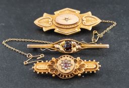 Three brooches,: including a Victorian, 15ct gold, ruby and seed pearl brooch,