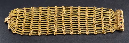 A Victorian, yellow silk and gilt metal cuff bracelet,