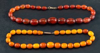 An amber and an amber and amber imitation necklace,: a necklace of opaque 'butterscotch' amber,