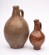 A large 17th century German stoneware Bellamine jug and one other: of traditional form with bearded