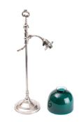 A silver plated student's lamp: with s-shaped reeded arm with green glass shade,