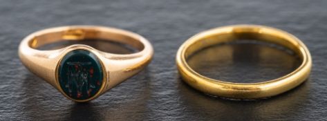 Two gold rings,: a 15ct gold, bloodstone, signet ring engraved with monogram,