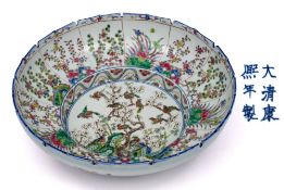 A Chinese famille rose bowl: with recessed cavetto and serrated rim,