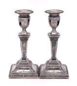 A pair of late Victorian silver candlesticks, maker Thomas Bradbury & Sons, London,