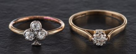 Two diamond rings,: a ring with four old-cut diamonds in the shape of a clover,