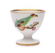 A rare Swansea egg cup: with coloured transfer decoration of two parakeets chained to knarled