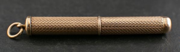 A 9ct gold toothpick with engine turned decoration,: with hallmarks for Birmingham, 1973,