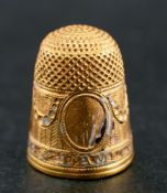 A late 18th century, 22ct gold, black and white enamel thimble,