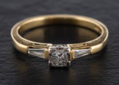An 18ct gold, princess and tapered baguette-cut diamond ring,