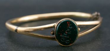 A Victorian, 18ct gold, bloodstone seal, hinged bangle bangle,: the seal engraved with name 'Ellie',