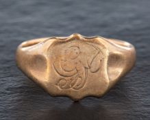 A 9ct gold signet ring,: with indistinct monogram engraving and hallmarks for London, 1930,