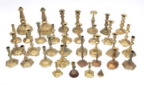 A collection of Georgian and later brass candlesticks: includes ejector and non-ejector types,