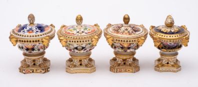 A group of four Derby pot-pourri vases and covers: of squat campana form with pineapple and bud