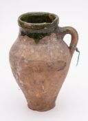 A pottery pitcher, probably Border Ware: the red body of oviform,