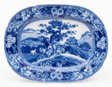 A transfer decorated meat plate: decorated in blue and white in the 'Piping Shepherd' pattern,