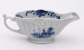 A Liverpool [William Reid] blue and white low-footed sauceboat: press-moulded and strap-fluted,