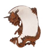A French carved and stained wood dressing table mirror modelled with a dragon,