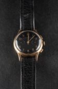 A 9ct gold gentleman's chronometer wristwatch: unsigned, the black dial with gilt Arabic numerals,