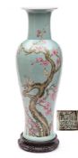 A large Chinese famille rose baluster vase: finely enamelled with four birds perched on a gnarled