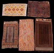 A Belouchistan bag:, the wine striped field with hooked designs and border, with forked tendrils,