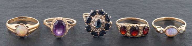Five rings,: including a 18ct gold opal ring with hallmarks for London, 1916, ring size Q,