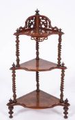 A Victorian walnut and burr walnut corner whatnot, circa 1870,