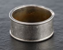 A wide band ring,: stamped 'PLAT', ring size N, width of band ca. 9mm, total weight ca. 10.2gms.