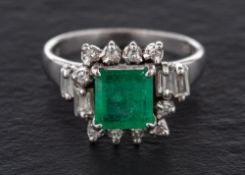A step-cut emerald, baguette-cut and single-cut diamond cluster ring,: calculated emerald weight ca.