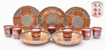 A set of five Japanese saucer dishes and a set of seven wine cups,