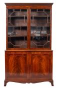A late George III mahogany and glazed cabinet bookcase, early 19th century,