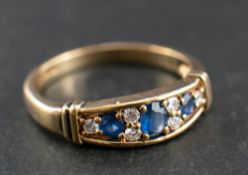 A 9ct gold, sapphire and round, brilliant-cut diamond ring,: total diamond weight 0.