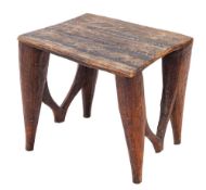 An African carved hardwood stool or low table, Nupe Tribe, central Nigeria, first half 20th century,