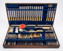 A cased Old English pattern plated flatware service: includes twelve table knives,