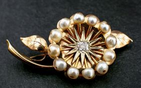 A cushion-cut diamond and pearl flower brooch,: estimated diamond weight ca. 0.