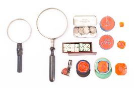 A set of miniature bone dominoes: contained in a mahogany case, two magnifying glasses,