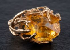 A dress ring set with a citrine crystal,: of organic design, ring size P, length of ring head 2.