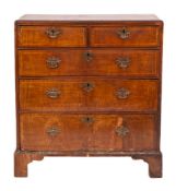 A George II walnut and crossbanded chest of drawers, mid 18th century,