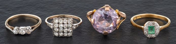 Four gemset rings,: including an emerald and diamond ring, estimated total diamond weight ca. 0.