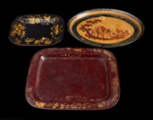 A 19th century tole ware oval tray: decorated with a village scene, 30.