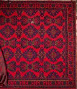 A Turkey carpet:, of large size and traditional design and colours,