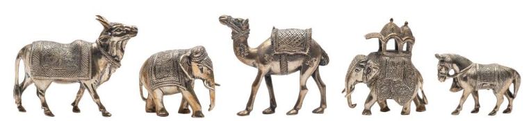 A collection of five Indian white metal animal models: includes, camel, horse, ox and two elephants,