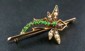 WITHDRAWN A peridot, ruby and seed pearl dragonfly brooch,: length ca. 5cm, total weight ca. 6gms.